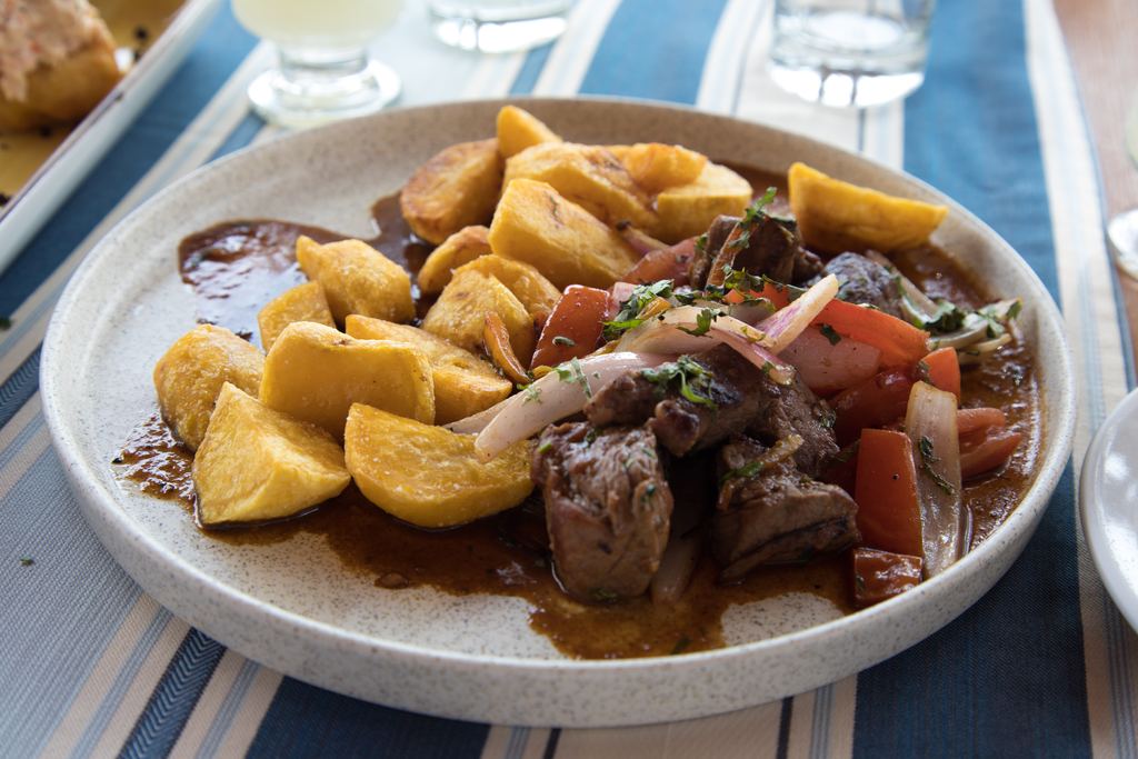 Plate of lomo saltado, a traditional Peruvian beef and potato dish