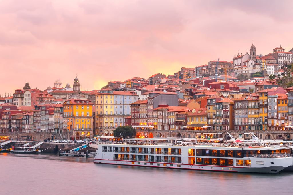 Colourful houses of the Ribeira district above the Douro river in Porto at sunset