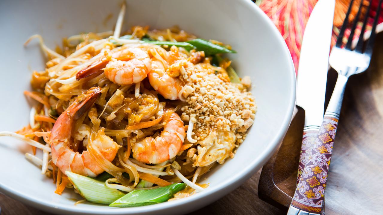Plate of pad thai stir-fried rice noodles, a Thai street food classic
