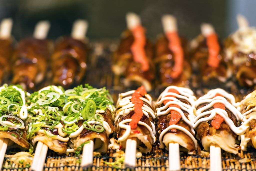 Traditional Japanese street food stall with signage in central Tokyo