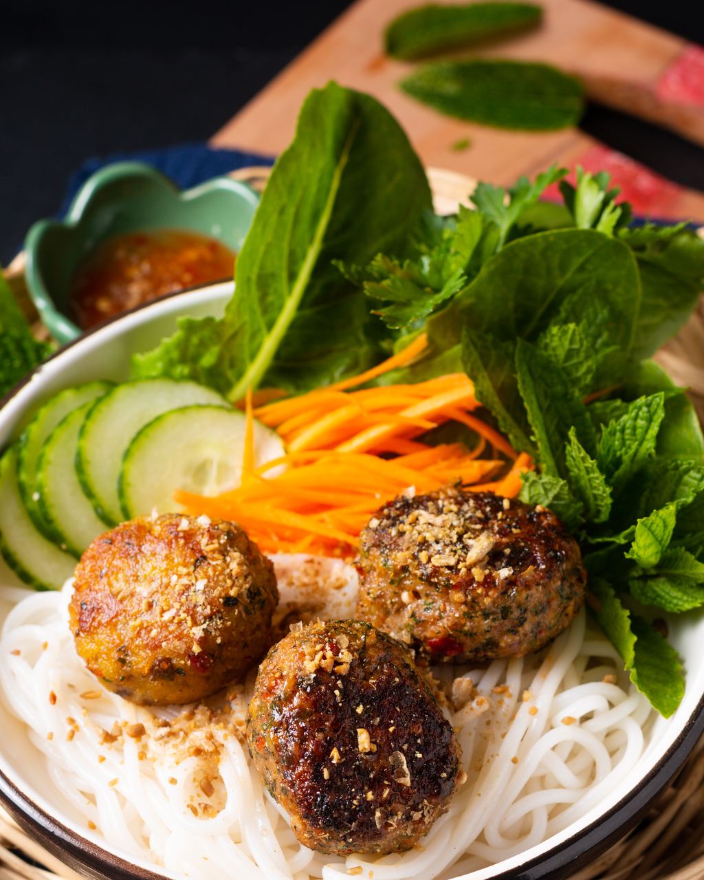 Bun cha with grilled pork meatballs, rice noodles, fresh herbs and dipping broth